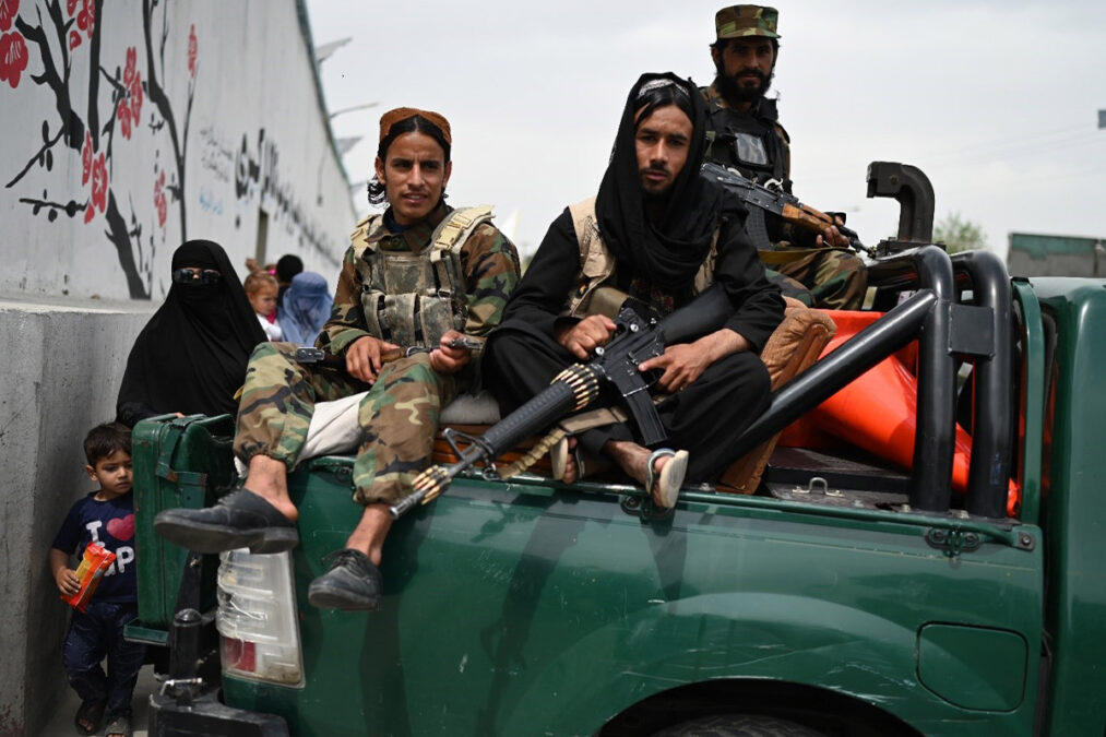 Taliban fighters posing for a photo in downtown Kabul on April 12, 2022.